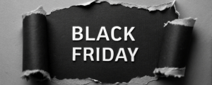 Black Friday escrito em letras brancas sobre fundo preto rasgado, destacando tema de promoções e estratégias de vendas para o período de ofertas.